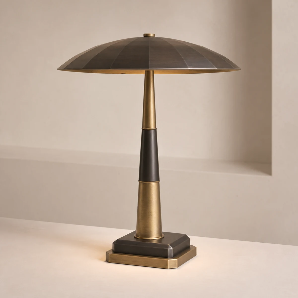 Deco Totem statement table lamp concept with a faceted canopy, segmented brass stem, and clipped square base