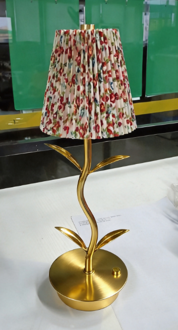 Actual floral pleated shade lamp with curved leaf stem and circular base